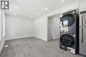 Windsor apartment for rent - A modern kitchen with a washing machine in the middle of the room.