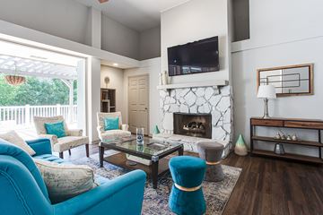 Marietta apartment for rent - A living room with a fireplace and a television mounted on the wall.