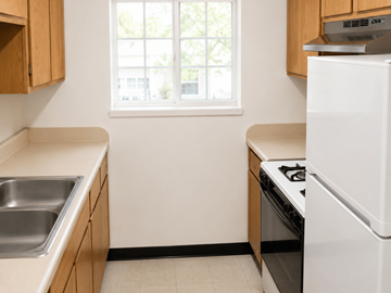 El Paso apartment for rent - A kitchen with a white fridge, stove, and dishwasher.