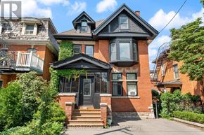 Hamilton (Durand) multi-family for rent - A large house with a black front door and windows.