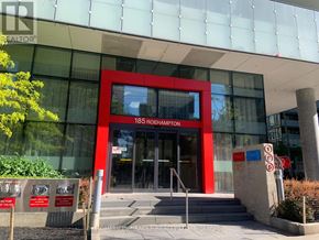 Toronto (Mount Pleasant West) condo for rent - The front of a building with a red and glass facade.