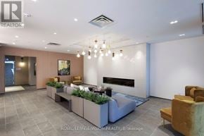 Milton (Cb Cobban) condo for rent - A modern living room with a grey floor and a white ceiling.