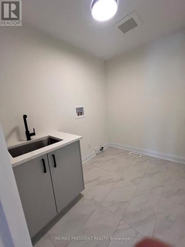 Niagara Falls (Marineland) apartment for rent - A kitchen area with a sink and cabinets.