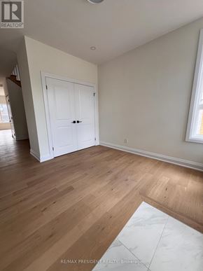 Niagara Falls (Marineland) apartment for rent - A room with a white door and wooden flooring.