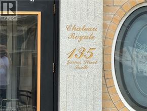 Hamilton condo for rent - A sign on a building that says Chateau Royale 135 James Street South.