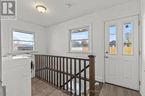Thorold (Thorold Downtown) multi-family for rent - A small room with a washer and dryer in it.