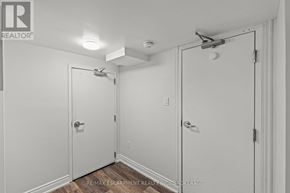 Thorold (Thorold Downtown) multi-family for rent - A white bathroom with a toilet and a sink.