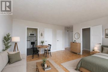 Toronto (Mount Pleasant East) condo for rent - A well-lit, spacious bedroom with a large bed and a separate dining area.