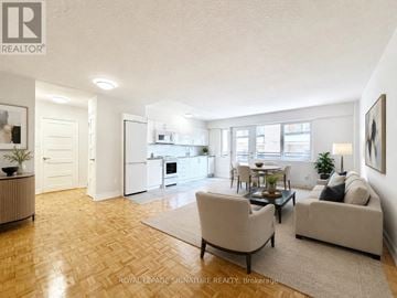 Toronto (Yonge-St. Clair) condo for rent - A well-lit living room with a couch, chairs, and a dining table.