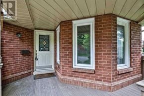 Markham (Buttonville) apartment for rent - A white door with a glass window is on the left and a white window with a glass window is on the right.