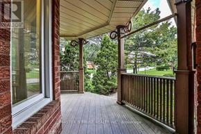Markham (Buttonville) apartment for rent - A porch with a wooden floor and a brick wall.