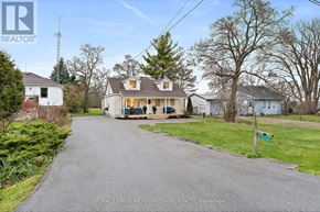 Halton Hills (Rural Halton Hills) apartment for rent - A residential area with houses and a road.