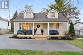 Halton Hills (Rural Halton Hills) apartment for rent - A house with a Royal LePage REALTOR sign in front.