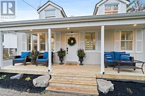 Halton Hills (Rural Halton Hills) apartment for rent - A white house with a porch and blue cushions.