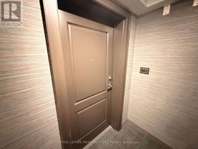 Hamilton (Waterdown) condo for rent - A brown door with a number 801 on the wall next to it.