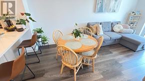 Hamilton (Waterdown) condo for rent - A dining room with a round table surrounded by chairs.