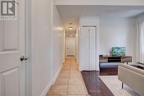 Guelph (Downtown) duplex for rent - A hallway with a white door and a white wall.