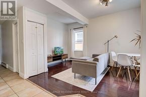 Guelph (Downtown) duplex for rent - A living room with a couch, chair, and television.