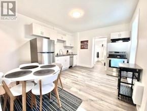 Belleville (Belleville Ward) apartment for rent - A modern kitchen with a dining table and chairs.