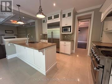 Oakville (Go Glenorchy) apartment for rent - A kitchen with a counter top and cabinets.