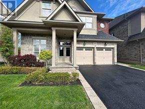 Oakville (Go Glenorchy) apartment for rent - A house with a driveway and garage doors numbered 432.