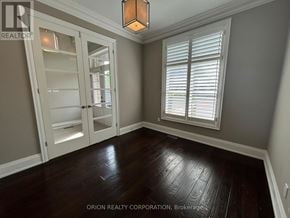 Oakville (Go Glenorchy) apartment for rent - A room with a wooden floor and a large window with white blinds.