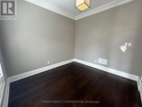 Oakville (Go Glenorchy) apartment for rent - A room with wood flooring and a light fixture on the ceiling.