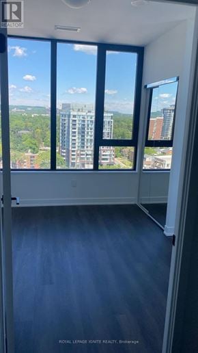 Burlington (Brant) condo for rent - A room with a view of the cityscape through large windows.