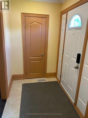 Hamilton (Ainslie Wood) apartment for rent - A hallway with a brown door and a white door with a black handle.