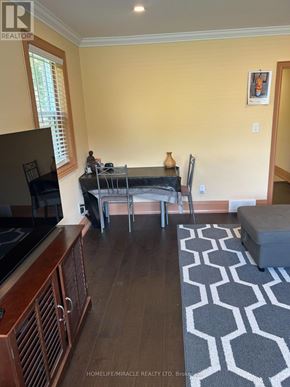 Hamilton (Ainslie Wood) apartment for rent - A living room with a television, a sofa, a coffee table, and a rug.