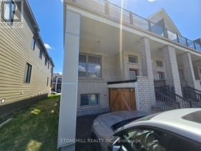 Ottawa townhouse for rent - A modern house with a car parked in front.