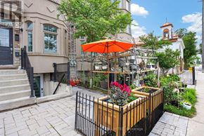 Toronto (O'connor-Parkview) townhouse for rent - A flower bed with red flowers in a wooden box.
