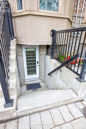 Toronto (O'connor-Parkview) townhouse for rent - A white door is on the left side of a black railing.