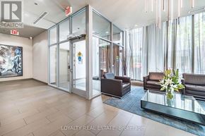 Toronto (Waterfront Communities) condo for rent - A kitchen with white cabinets and a countertop is shown in an empty room.