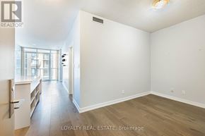 Toronto (Waterfront Communities) condo for rent - A room with a wall of pictures and a logo that says Loyalty Real Estate Brokerage.