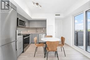 Toronto (Clanton Park) condo for rent - A modern kitchen with a table and chairs.