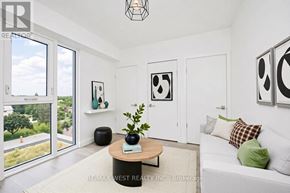 Toronto (Clanton Park) condo for rent - A living room with a couch, a coffee table, and pictures on the wall.