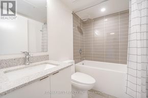 Toronto (Clanton Park) condo for rent - A white bathroom with a sink, toilet and bathtub.