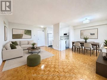 Toronto (University) condo for rent - A living room with a couch, chairs, and a coffee table.