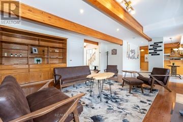 Caledon (Caledon East) apartment for rent - A living room with brown leather couches and a wooden floor.