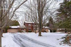 Caledon (Caledon East) apartment for rent - A house with a driveway covered in snow.
