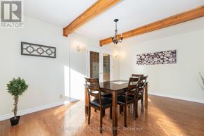 Caledon (Caledon East) apartment for rent - A dining room with a wooden table and chairs.