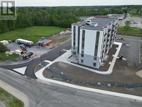 North Grenville apartment for rent - A building under construction with a sign that says Innovation Realty Ltd., Brokerage.