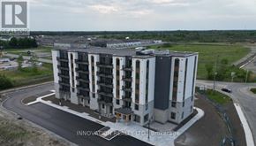 North Grenville apartment for rent - A large, modern building with a curved driveway in front of it.