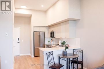 North Grenville apartment for rent - A modern kitchen with a dining table set up.