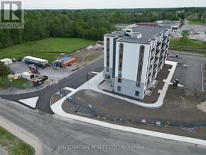 North Grenville apartment for rent - A building under construction with a sign that says Innovation Realty Ltd., Brokerage.