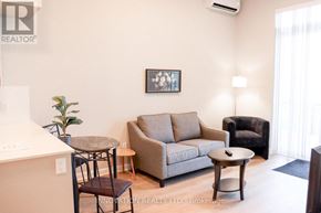 North Grenville apartment for rent - A living room with a couch, chair, and coffee table.