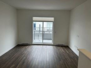 Surrey townhouse for rent - A room with a window and a balcony.