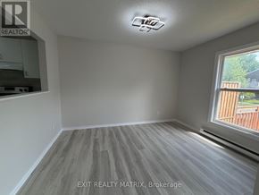 Ottawa townhouse for rent - A room with EXIT REALTY MATRIX, Brokerage written on the wall.