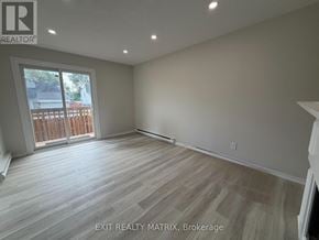 Ottawa townhouse for rent - A room with EXIT REALTY MATRIX, Brokerage written on the wall.